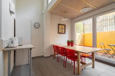 a kitchen and dining room with a table and chairs at Stay U-nique Apartment Maurici Serrahima in Barcelona