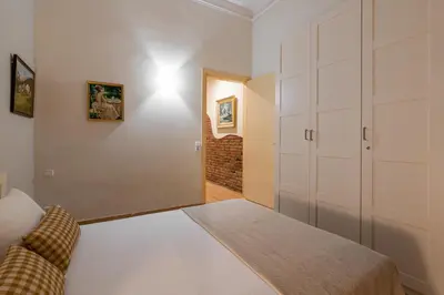 a small bedroom with a bed and a closet at Stay U-nique Apartment Maurici Serrahima in Barcelona