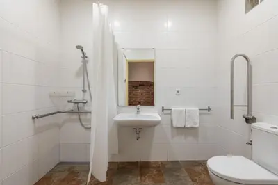 a white bathroom with a sink and a toilet at Stay U-nique Apartment Maurici Serrahima in Barcelona