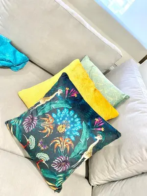 two pillows sitting on top of a couch at Barcelona Chic Apartments- Free Parking - 10 min BCN center by metro in Barcelona