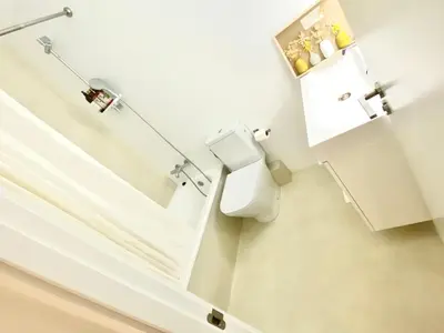 a bathroom with a toilet and a mirror at Barcelona Chic Apartments- Free Parking - 10 min BCN center by metro in Barcelona