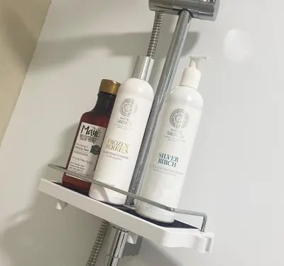 a shelf in a refrigerator with two bottles of alcohol at Barcelona Chic Apartments- Free Parking - 10 min BCN center by metro in Barcelona