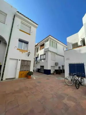 a group of buildings with bikes parked in a courtyard at Marina Beach Aiguadolç Sitges in Sitges