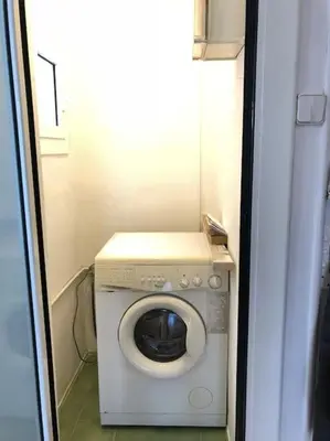 a washer and dryer in a small room at Nice 2 rooms apartment in the heart of barcelona in Barcelona