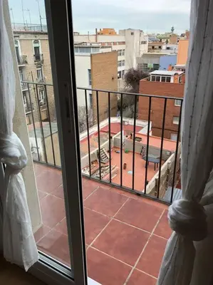 a window with a view of a courtyard from a building at Nice 2 rooms apartment in the heart of barcelona in Barcelona