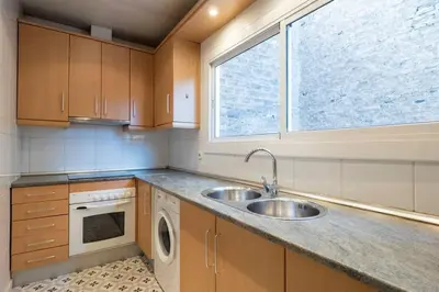 a kitchen with a sink and a window at Bebarceloner Poble Nou Apartaments - 2 bedroom in Barcelona