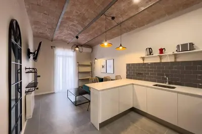 a kitchen with a sink and a counter top at BeBarceloner Sants Apartments - 2 bedrooms in Barcelona