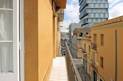 a view of a city street from a window at BeBarceloner Sants Apartments - 2 bedrooms in Barcelona