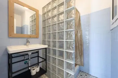 a bathroom with a sink and a mirror at BeBarceloner Sant Andreu Apartments - 3 bedrooms in Barcelona