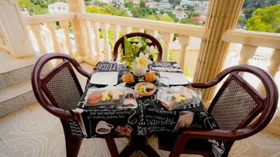 a table with food on it on a balcony at La Casa de Mima in Cubelles