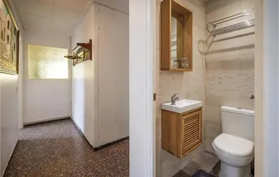 a bathroom with a toilet and a sink at Nice Apartment In Pineda De Mar in Pineda de Mar