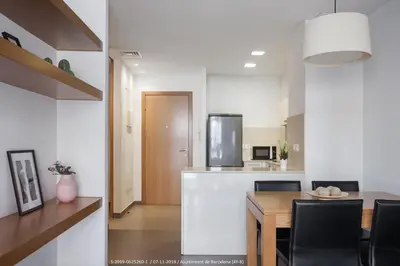 a kitchen and dining room with a table and chairs at Flateli Navas D02 in Barcelona