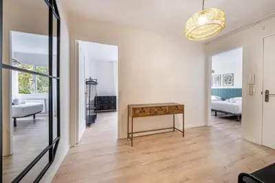 a living room with a couch and a table and chairs at BeBarceloner Eixample Apartments- 4 bedrooms in Barcelona