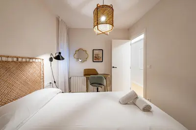 a hallway with white walls and a ceiling at BeBarceloner Eixample Apartments - 4 bedrooms in Barcelona