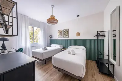 a dressing room with a mirror and a dressing table at BeBarceloner Eixample Apartments - 4 bedrooms in Barcelona