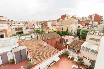 an aerial view of a city with buildings at BeBarceloner Sant Andreu Apartments - Attic with terrace in Barcelona