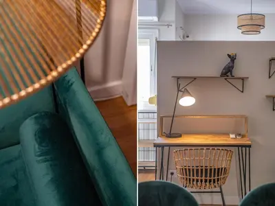 a living room with a green couch and a table at BeBarceloner Sant Andreu Apartments - 1 bedroom with terrace in Barcelona