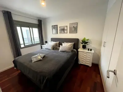 a bedroom with a bed with two pillows on it at Pure Bliss Apartment Sitges in Sitges