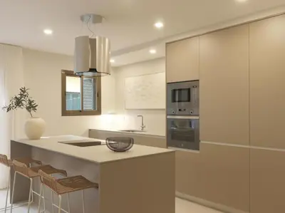 a kitchen with a large island with a counter top at Sitges Spaces Bonaire Beach Condo in Sitges