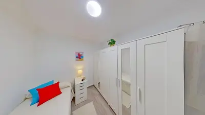 a white bedroom with a white closet and a white cabinet at PREMIUM HABITAT LA RIERA in Pineda de Mar