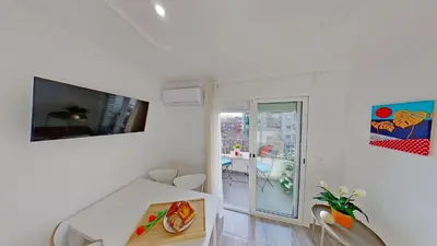 a white room with a table and a window at PREMIUM HABITAT LA RIERA in Pineda de Mar