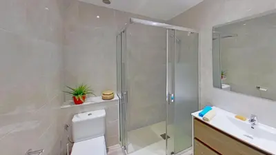 a bathroom with a shower and a toilet and a sink at PREMIUM HABITAT LA RIERA in Pineda de Mar