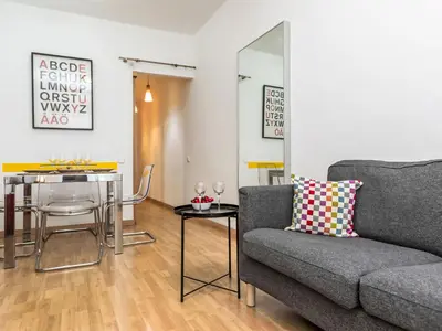 a living room with a couch and a table at Apartment Sants-Montjuïc- Avenida Madrid by Interhome in Barcelona