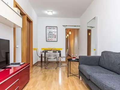 a living room with a couch and a table at Apartment Sants-Montjuïc- Avenida Madrid by Interhome in Barcelona
