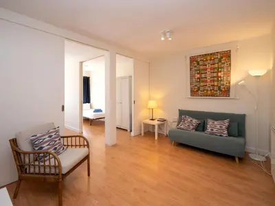 a living room with a couch and a chair at Apartment Sagrada Familia- Rossello by Interhome in Barcelona