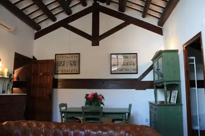 a living room with a table and a couch at Cal Negre 2 in Vilassar de Mar