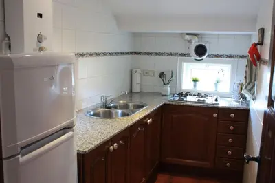 a kitchen with a sink and a counter top at Cal Negre 2 in Vilassar de Mar