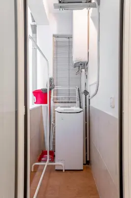 a bathroom with a shower and a bed in a room at The Collection Barcelona - Eixample - Bright and modern 4BD only for Families or Business groups in Barcelona