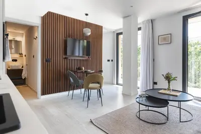 a living room with a table and chairs at master La Rambla in Barcelona
