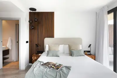 a bedroom with a large white bed with pillows at master La Rambla in Barcelona