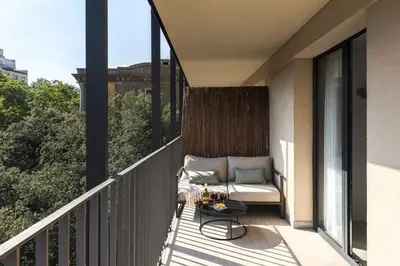 a balcony with a couch and a table at master La Rambla in Barcelona