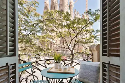 a table on a balcony with a view of the city at Click&Flat Gaudi Dream I in Barcelona