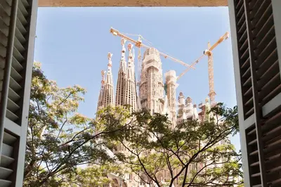 a view of the sagrada familia cathedral from a window at Click&Flat Gaudi Dream I in Barcelona