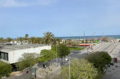 a view of a street with a building and a road at Apartment with sea views next to the beach of Mar Bella in Barcelona