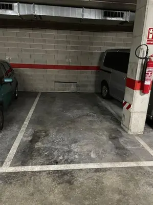 a parking garage with a van parked in it at Apartment with sea views next to the beach of Mar Bella in Barcelona